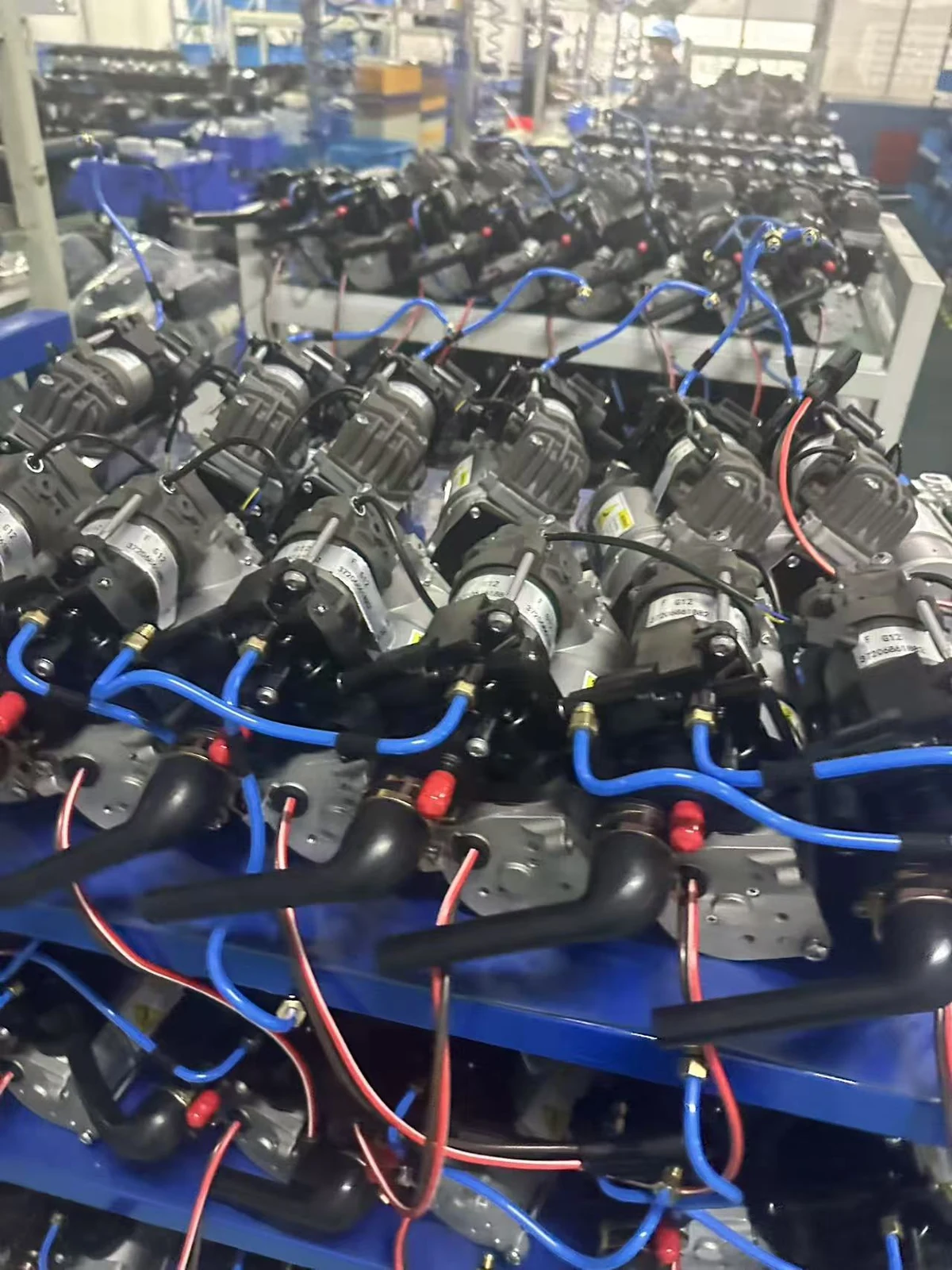 Air suspension compressors connected to air hoses